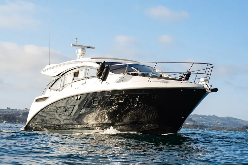 Slide: The Image of 2016 Sea Ray Sundancer 400 yacht cruising on open water under a clear sky. - 2