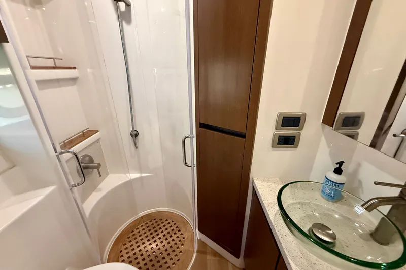Slide: The Image of Luxurious bathroom in 2016 Sea Ray Sundancer 400 yacht with modern shower and glass sink. - 38