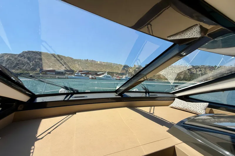 Slide: The Image of Interior view of 2016 Sea Ray Sundancer 400 yacht with scenic harbor backdrop. - 35