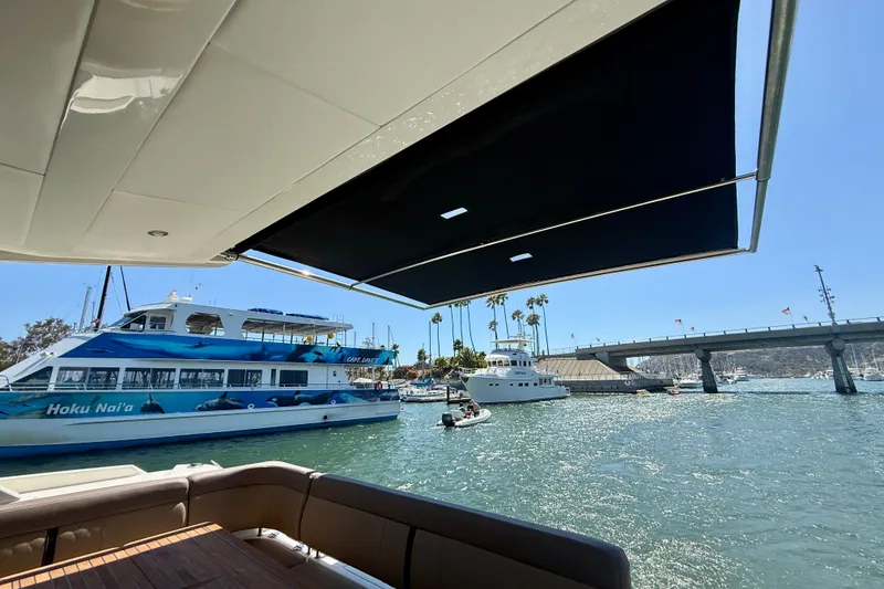 Slide: The Image of 2016 Sea Ray Sundancer 400 yacht view with marina and boats in the background. - 57