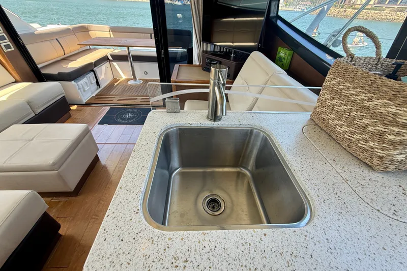 Slide: The Image of Luxurious interior of 2016 Sea Ray Sundancer 400 yacht with modern kitchen sink. - 21