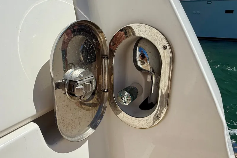 Slide: The Image of Fuel cap and water inlet on a 2016 Sea Ray Sundancer 400 yacht. - 55