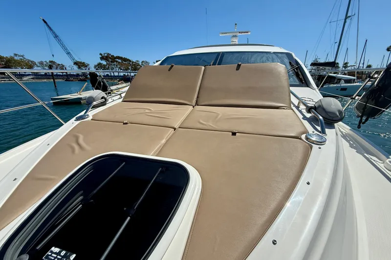Slide: The Image of 2016 Sea Ray Sundancer 400 yacht with sunbathing deck, docked in a marina. - 59