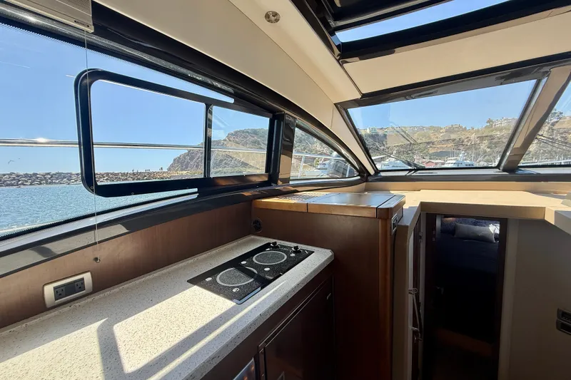 Slide: The Image of Interior view of 2016 Sea Ray Sundancer 400 yacht with scenic ocean backdrop. - 18