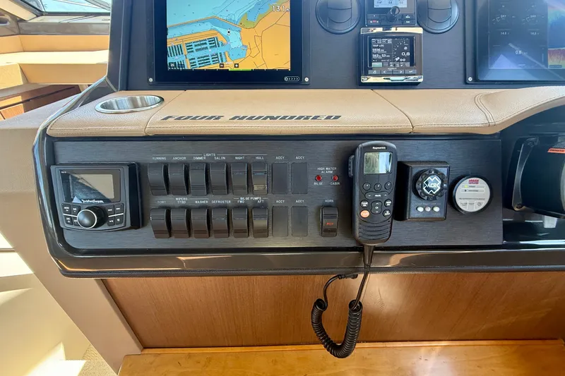 Slide: The Image of Control panel of a 2016 Sea Ray Sundancer 400 yacht with navigation and communication equipment. - 33