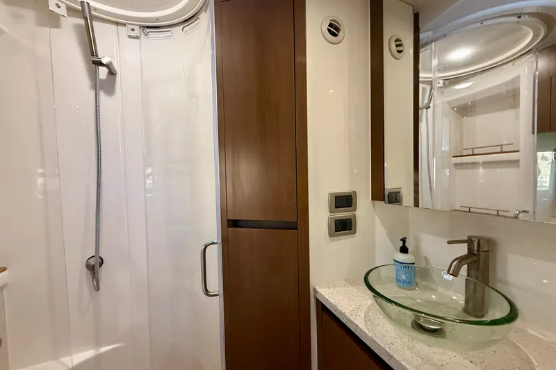 Slide: The Image of Luxurious bathroom in 2016 Sea Ray Sundancer 400 yacht with glass sink and modern shower. - 39