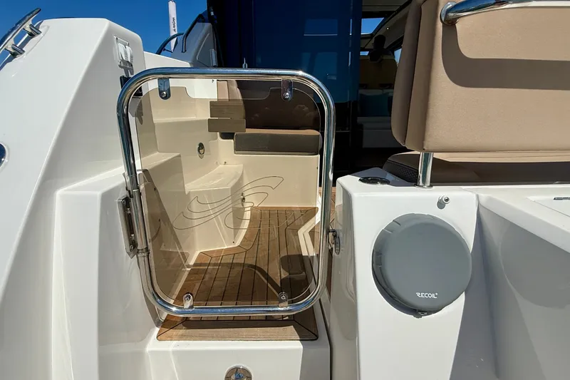 Slide: The Image of 2016 Sea Ray Sundancer 400 yacht entrance with teak flooring and glass door. - 56