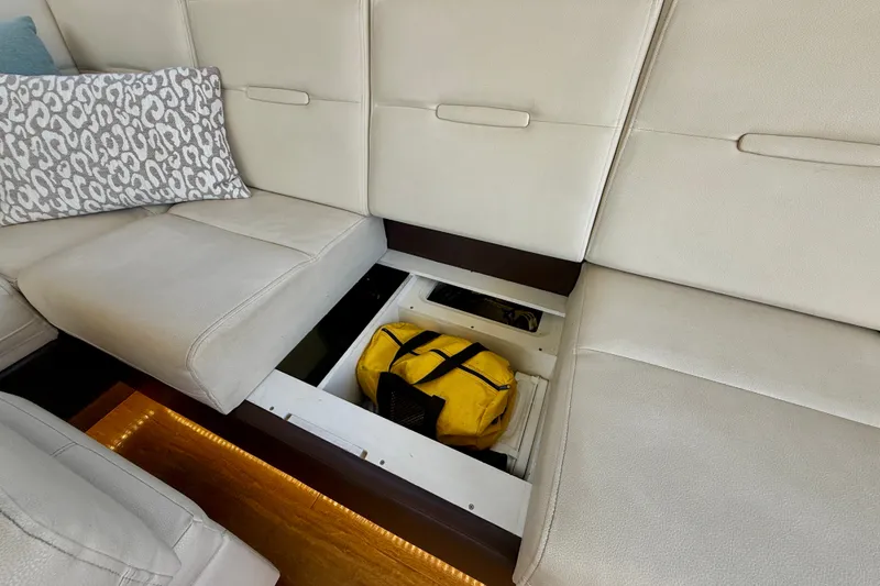 Slide: The Image of Under-seat storage on 2016 Sea Ray Sundancer 400 yacht with yellow bag. - 14