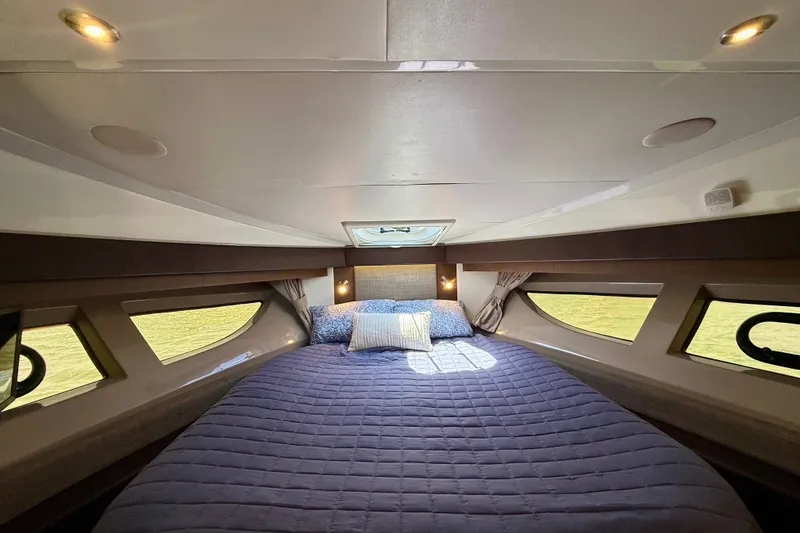 Slide: The Image of Luxurious cabin interior of 2016 Sea Ray Sundancer 400 yacht with cozy bedding. - 37