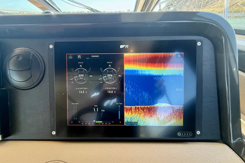 Slide: The Image of Dashboard display of a 2016 Sea Ray Sundancer 400, showing engine and sonar data. - 32