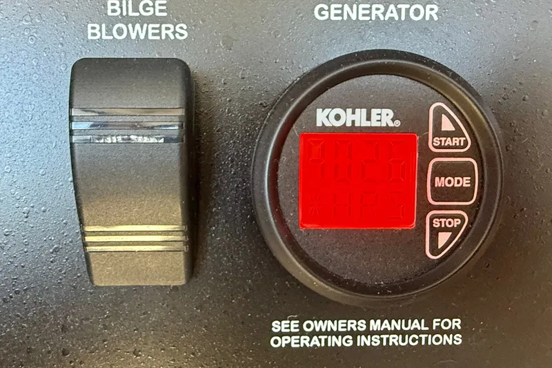 Slide: The Image of Control panel of a 2016 Sea Ray Sundancer 400 with Kohler generator display. - 70