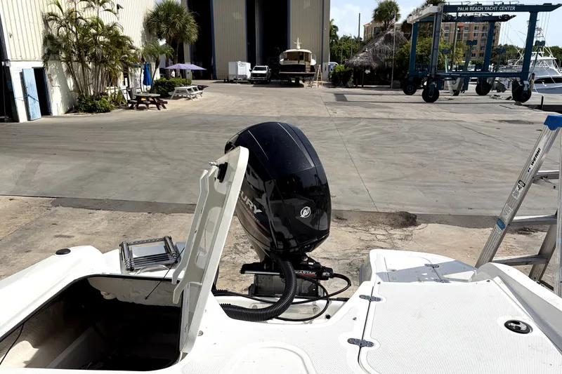 Slide: The Image of 2019 Tahoe 550 TS boat with Mercury outboard motor at yacht center. - 12