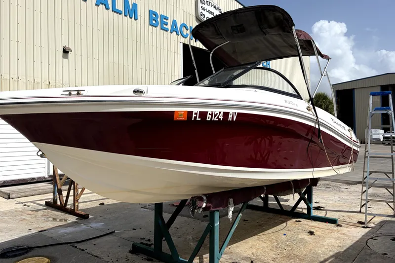 Slide: The Image of 2019 Tahoe 550 TS boat on stands at Palm Beach facility. - 4