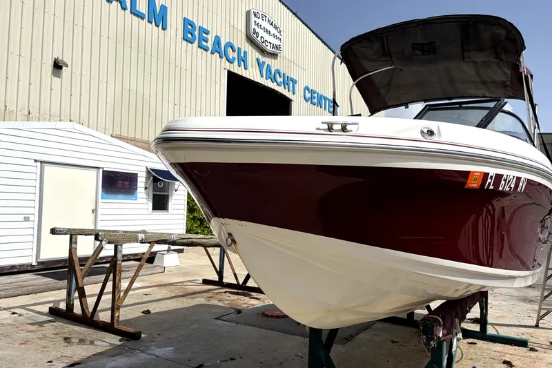 Slide: The Image of 2019 Tahoe 550 TS boat at Palm Beach Yacht Center, displayed on stands. - 2