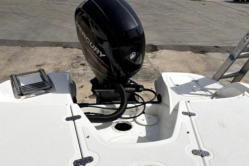 Slide: The Image of 2019 Tahoe 550 TS boat with Mercury outboard motor on a concrete surface. - 9