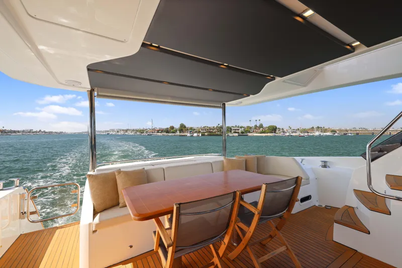 Slide: The Image of Luxurious 2015 Absolute Fly Co Ownership yacht with spacious deck and scenic ocean view. - 12