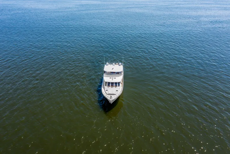 Slide: The Image of Aerial view of 2005 Offshore Yachts 66 Pilot House on open water. - 57