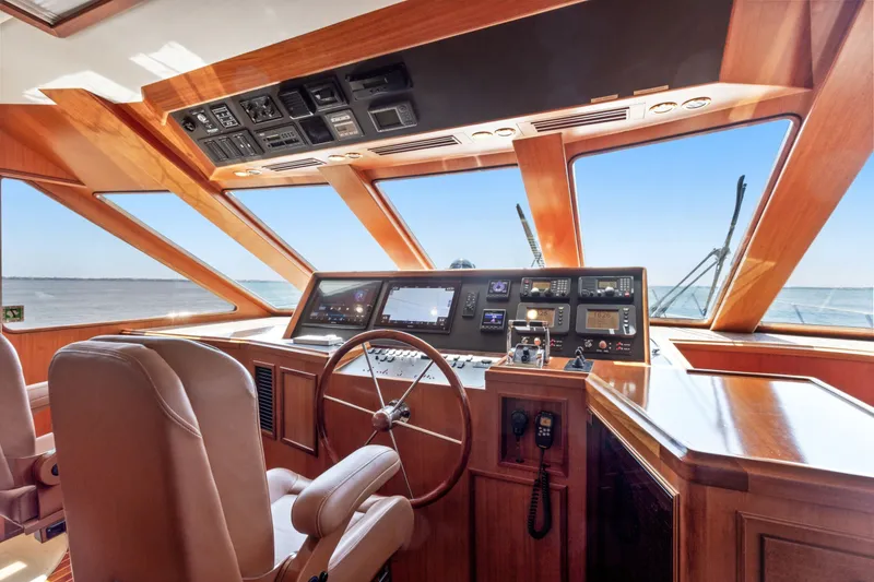 Slide: The Image of Luxurious 2005 Offshore Yachts 66 Pilot House helm with panoramic ocean view. - 16