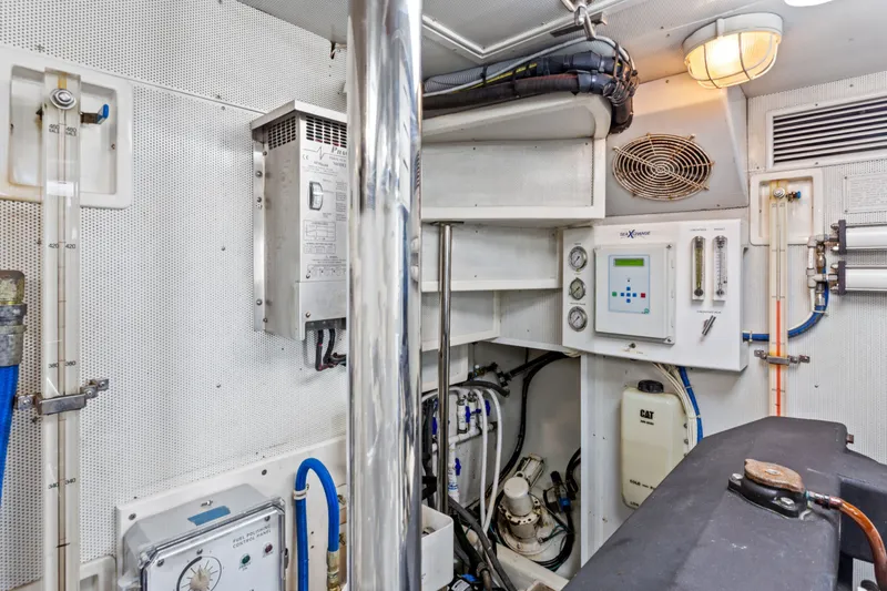 Slide: The Image of Engine room of 2005 Offshore Yachts 66 Pilot House with control panels and equipment. - 47