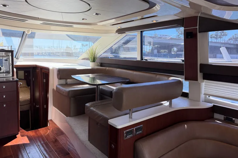 Slide: The Image of The interior of a 2014 Meridian 441 Sedan features an elegant seating area with brown upholstery and a table. - 17