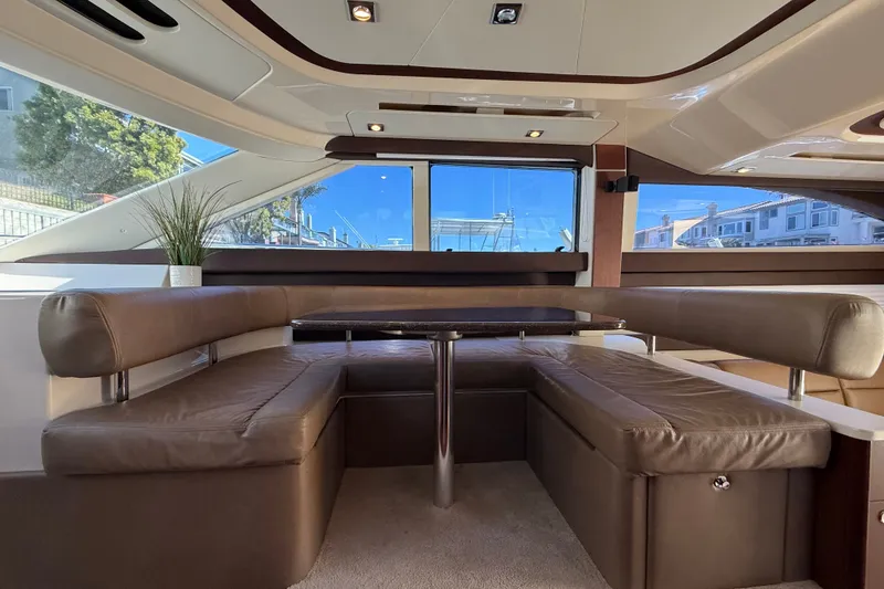 Slide: The Image of Interior of a 2014 Meridian 441 Sedan with brown leather seating and a table. - 18