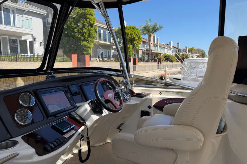 Slide: The Image of The cockpit of a 2014 Meridian 441 Sedan with a luxurious leather seat and modern navigation equipment. - 46
