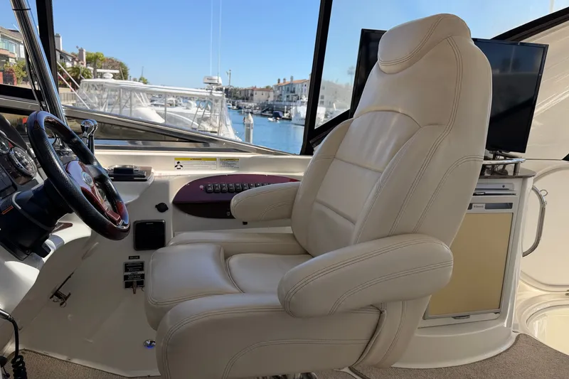 Slide: The Image of The helm of a 2014 Meridian 441 Sedan with a comfortable leather seat and steering wheel. - 47