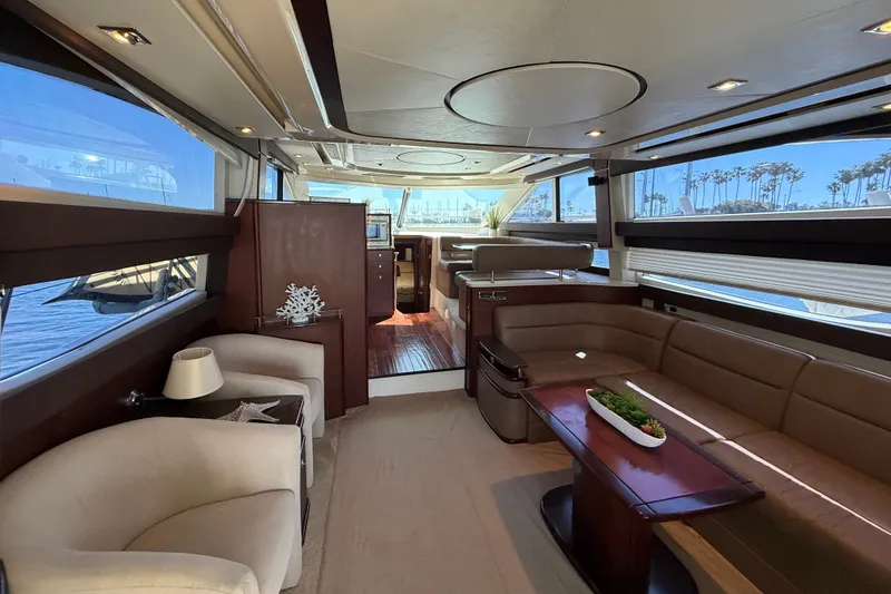 Slide: The Image of Interior of a 2014 Meridian 441 Sedan with elegant seating and a wooden table. - 8