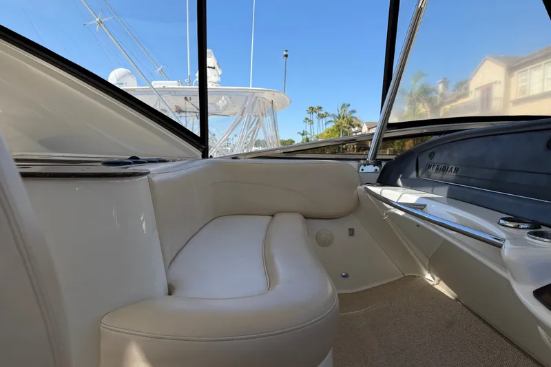 Slide: The Image of The 2014 Meridian 441 Sedan features an elegant seating area with beige upholstery and large windows. - 45