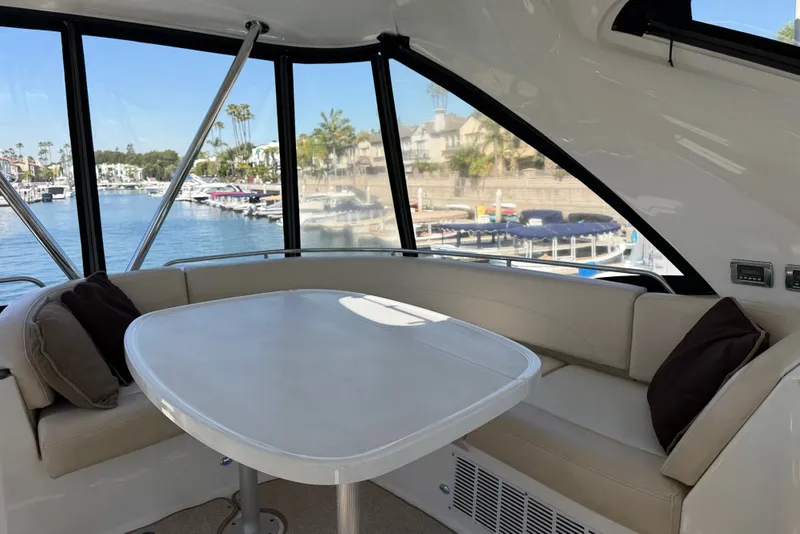 Slide: The Image of Interior of a 2014 Meridian 441 Sedan with a table and seating area. - 39