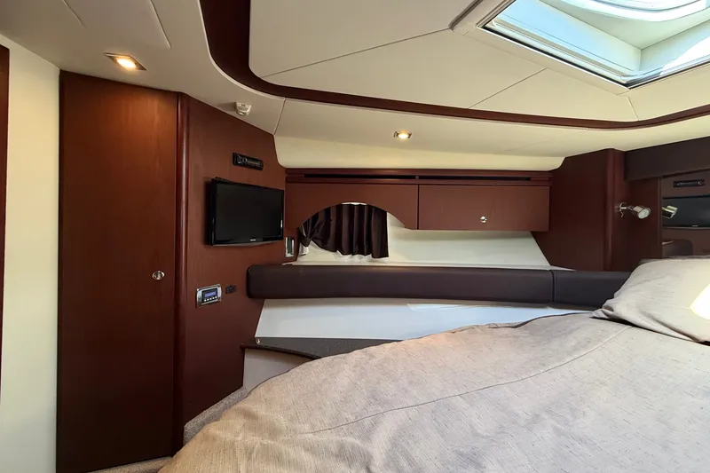 Slide: The Image of Interior of a 2014 Meridian 441 Sedan with elegant wood accents and a skylight. - 24