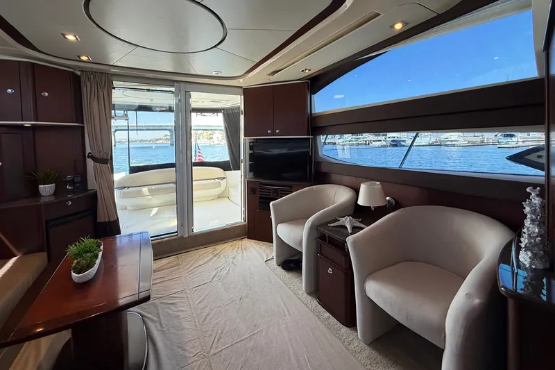 Slide: The Image of Interior of a 2014 Meridian 441 Sedan with elegant seating and a view of the harbor. - 13