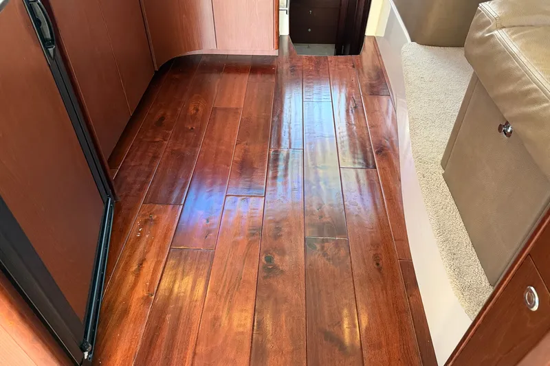 Slide: The Image of Wooden flooring in a yacht with carpet and cabinets. - 20