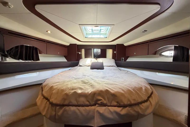 Slide: The Image of The 2014 Meridian 441 Sedan cabin features a cozy bed with overhead skylights. - 22
