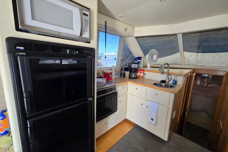 Slide: The Image of Interior of 1998 Carver 370 Voyager yacht kitchen with appliances and sink. - 8
