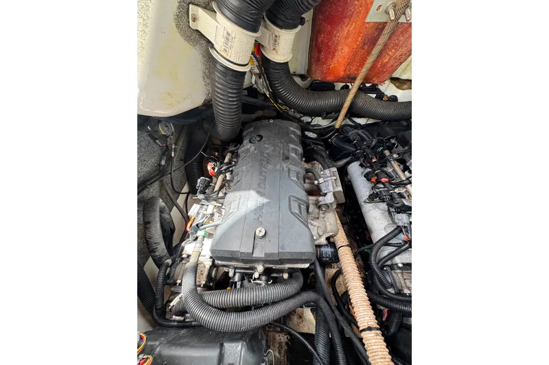 Slide: The Image of Engine compartment of a 2015 Yamaha Boats AR240, showcasing intricate wiring and components. - 41