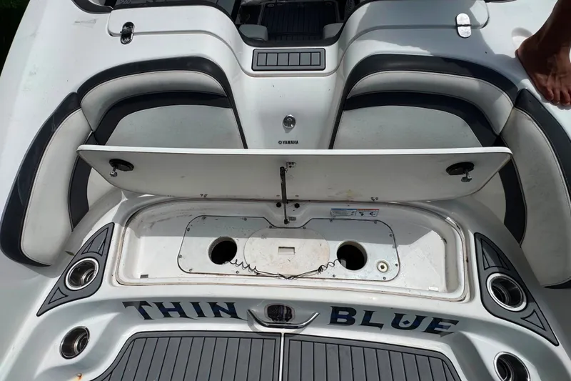 Slide: The Image of 2015 Yamaha Boats AR240 rear seating and storage area with "Thin Blue" text. - 15
