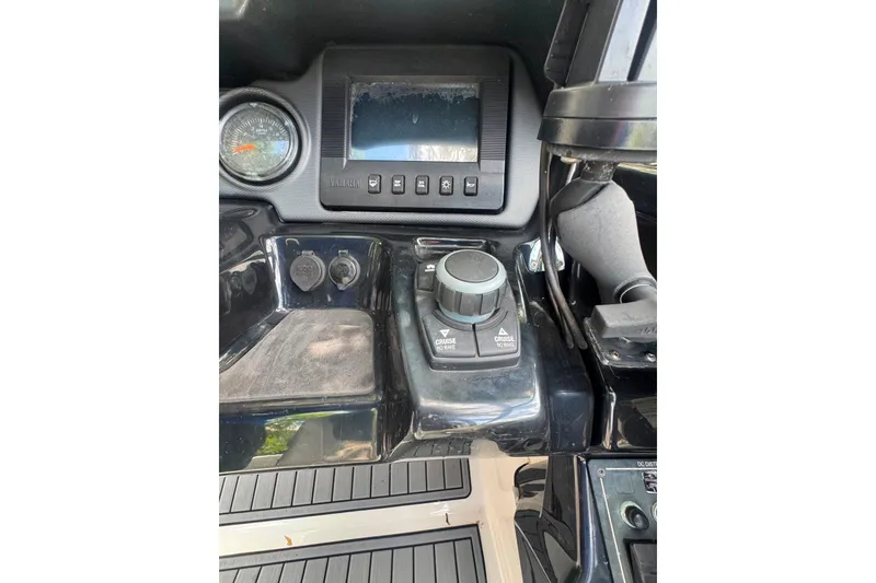 Slide: The Image of Control panel of a 2015 Yamaha Boats AR240, featuring navigation and cruise controls. - 31