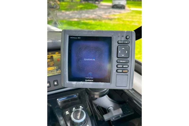 Slide: The Image of Garmin navigation system on 2015 Yamaha Boats AR240 dashboard, displaying loading screen. - 30