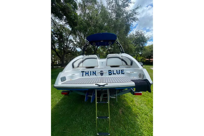 Slide: The Image of 2015 Yamaha Boats AR240, rear view, on grass with "Thin Blue" text. - 13