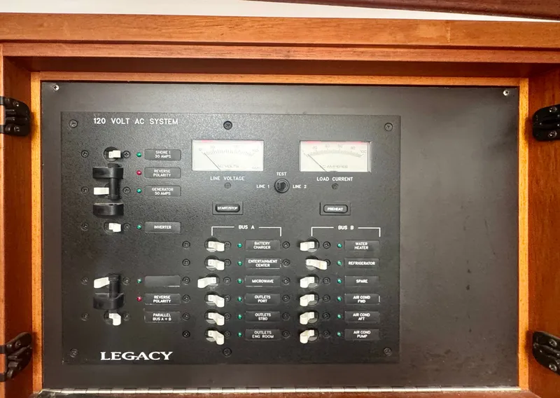 Slide: The Image of The image shows an electrical panel system with various switches and gauges. - 37