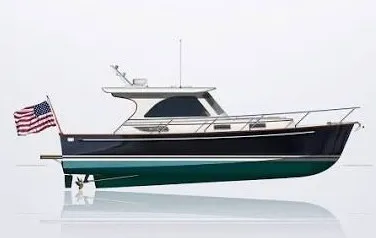 Slide: The Image of A 2003 Legacy 34 Express boat with an American flag at the stern. - 42