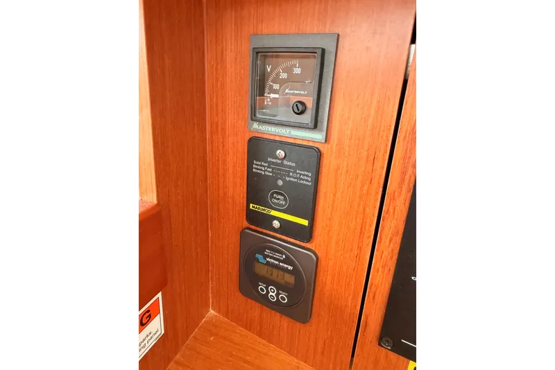 Slide: The Image of Control panel on 2017 Beneteau Oceanis 41.1 yacht with voltage meter and switches. - 92