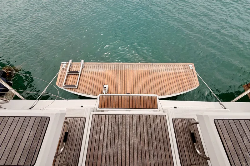 Slide: The Image of Beneteau Oceanis 41.1 (2017) yacht stern with wooden swim platform and ladder. - 32