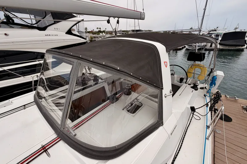 Slide: The Image of 2017 Beneteau Oceanis 41.1 sailboat with black canopy docked at marina. - 24