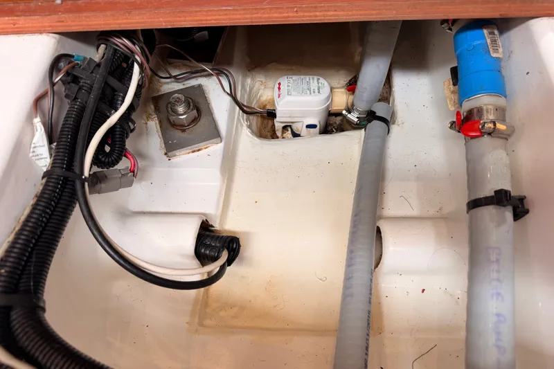 Slide: The Image of Bilge area of a 2017 Beneteau Oceanis 41.1 sailboat, showing wiring and plumbing components. - 108