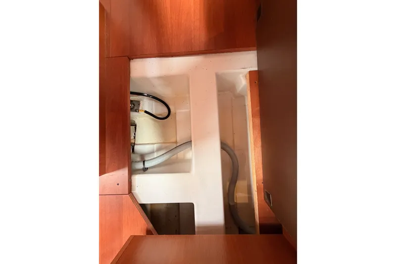 Slide: The Image of Interior view of 2017 Beneteau Oceanis 41.1 yacht showing storage compartment and plumbing. - 106