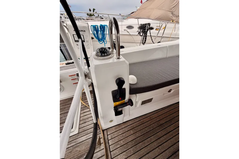Slide: The Image of 2017 Beneteau Oceanis 41.1 yacht cockpit with compass and seating area. - 41