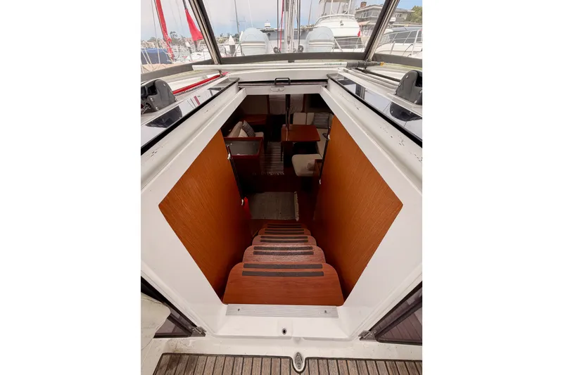 Slide: The Image of Stairway leading to the interior cabin of a 2017 Beneteau Oceanis 41.1 yacht. - 58