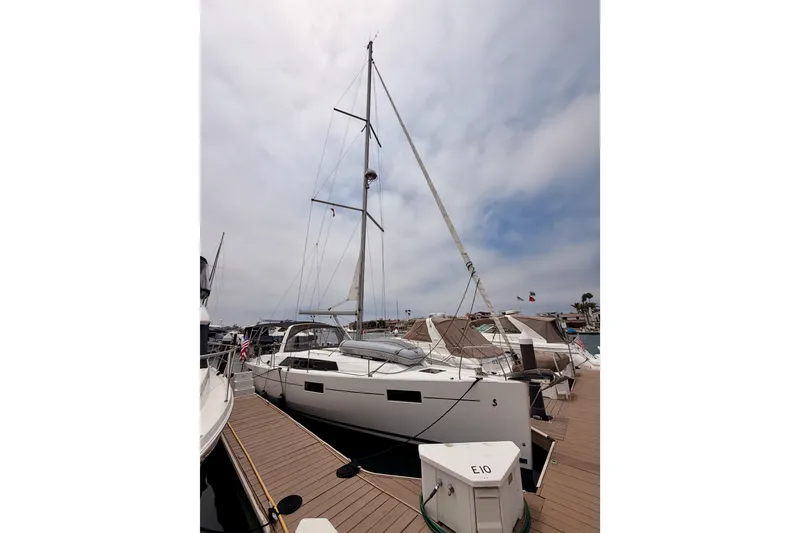 Slide: The Image of 2017 Beneteau Oceanis 41.1 sailboat docked at marina under cloudy sky. - 4